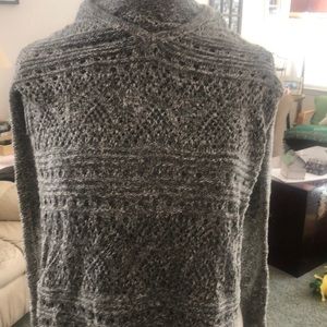 Green and whit knitted hooded sweater.